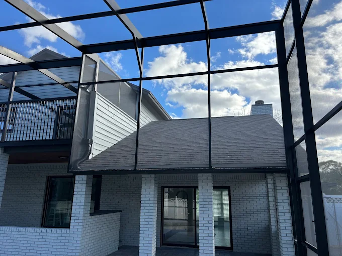 Finished roof behind a screened pool lanai